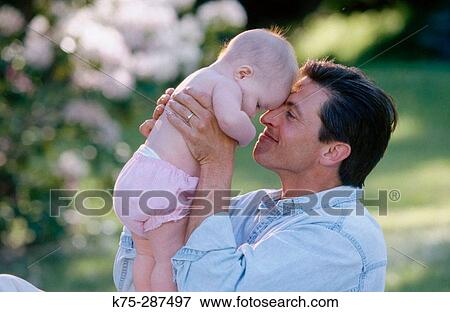 Happy dad with his new baby View Large Photo Image Stock Photo - Happy dad with his new baby. Fotosearch