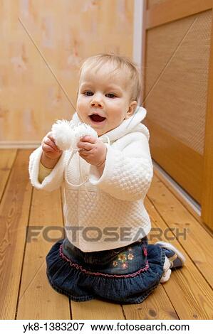 Happy Emotional Smiling Ten Month Old Baby Kneel Down View Large Photo Image Stock Photo - Happy Emotional Smiling Ten Month Old Baby Kneel Down. Fotosearch