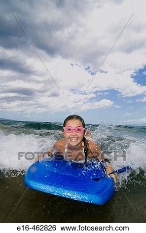 Happy girl boogie boarder View Large Photo Image Stock Photograph - Happy girl boogie boarder. Fotosearch