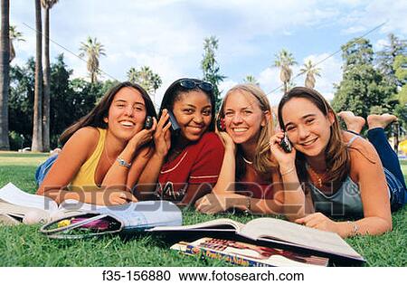 Happy girls on cell phones View Large Photo Image Stock Image - Happy girls on cell phones. Fotosearch