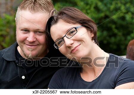 Happy husband and wife enjoying each others company on a summer outing age 35 and 30 St Paul Minnesota MN USA. View Large Photo Image Stock Photo - Happy husband and wife enjoying each others company on a summer outing age 35 and 30 St Paul Minnesota MN USA.. Fotosearch