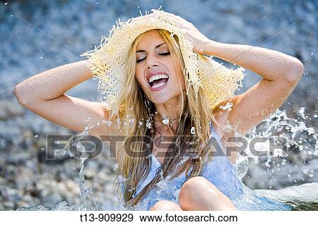 Happy in water young woman View Large Photo Image Stock Photo - Happy in water young woman. Fotosearch