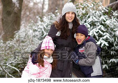 Happy Latino family Posing for a Portrait in the Park View Large Photo Image Stock Photo - Happy Latino family Posing for a Portrait in the Park. Fotosearch