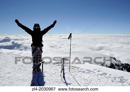 Happy mountaineer on the summit of Mount Kazbek, 5047m. Georgia, Greater Caucasus, Mtskheta-Mtianeti, Mount Kazbek. Model Released. 1015 View Large Photo Image Stock Photo - Happy mountaineer on the summit of Mount Kazbek, 5047m. Georgia, Greater Caucasus, Mtskheta-Mtianeti, Mount Kazbek. Model Released. 1015. Fotosearch