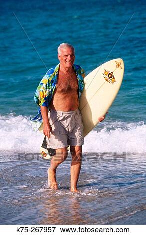 Happy senior surfer View Large Photo Image Stock Photo - Happy senior surfer. Fotosearch