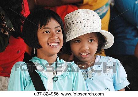Happy sisters at Guwang Sukawati Art Market, Bali View Large Photo Image Stock Photograph - Happy sisters at Guwang Sukawati Art Market, Bali. Fotosearch