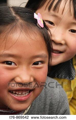 happy smiling and curious little girls in Kunming China View Large Photo Image Stock Image - happy smiling and curious little girls in Kunming China. Fotosearch