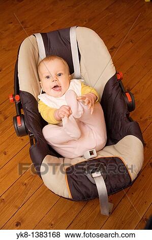 Happy Smiling Seven Month Old Baby in Safety Cradle View Large Photo Image Stock Photo - Happy Smiling Seven Month Old Baby in Safety Cradle. Fotosearch