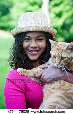 Happy teen with her cat View Large Photo Image Stock Photography - Happy teen with her cat. Fotosearch