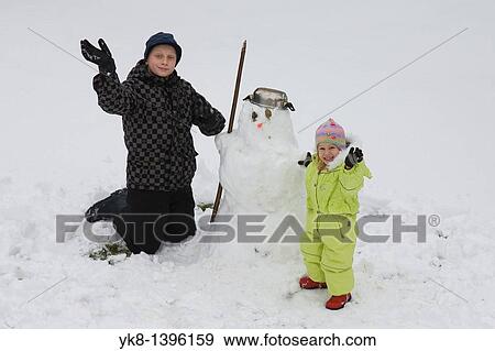 Happy Teenage Boy and Smiling Kid Girl Doing Snowman View Large Photo Image Stock Photo - Happy Teenage Boy and Smiling Kid Girl Doing Snowman. Fotosearch