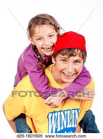 happy teenage boy giving his little sister piggy back ride - isolated on white View Large Photo Image Stock Photography - happy teenage boy giving his little sister piggy back ride - isolated on white. Fotosearch