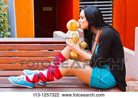 Happy teenage girl is kissing a teddy bear View Large Photo Image Stock Image - Happy teenage girl is kissing a teddy bear. Fotosearch