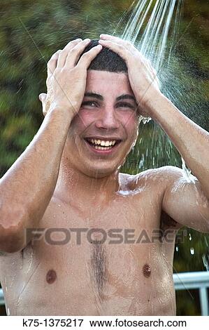 happy teenager showering outdoors View Large Photo Image Stock Photo - happy teenager showering outdoors. Fotosearch