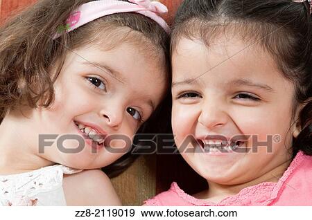 Happy twins smiling. View Large Photo Image Stock Photo - Happy twins smiling.. Fotosearch
