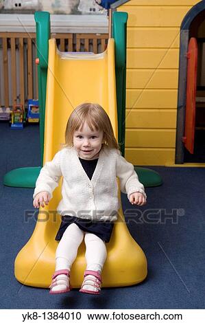 Happy Two Year Old Kid Girl Sliding Downlide on Playground View Large Photo Image Stock Image - Happy Two Year Old Kid Girl Sliding Downlide on Playground. Fotosearch