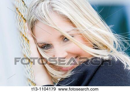 Happy with a messy hair young woman View Large Photo Image Stock Photo - Happy with a messy hair young woman. Fotosearch