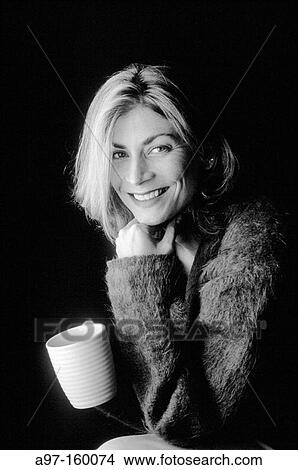 Picture - Happy woman drinking coffee. Fotosearch