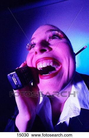 Stock Image - Happy woman on phone. Fotosearch