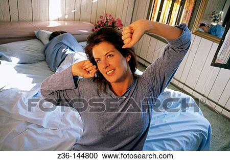 Happy woman stretching at morning View Large Photo Image Stock Image - Happy woman stretching at morning. Fotosearch