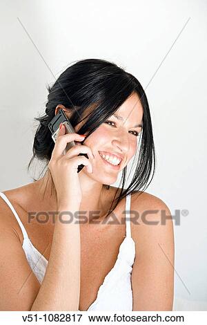 Happy woman talking on the phone View Large Photo Image Stock Photo - Happy woman talking on the phone. Fotosearch