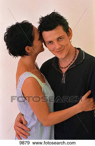 Happy young couple indoors View Large Photo Image Stock Photo - Happy young couple indoors. Fotosearch