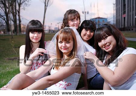 happy young friends group have fun and celebrate at the sunset in park on grass View Large Photo Image Stock Image - happy young friends group have fun and celebrate at the sunset in park on grass. Fotosearch