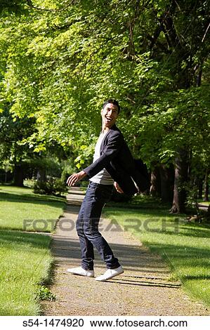 Happy young hispanic male outdoors View Large Photo Image Stock Image - Happy young hispanic male outdoors. Fotosearch