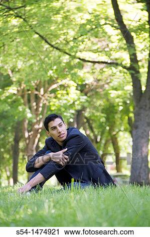 Happy young hispanic male outdoors View Large Photo Image Stock Image - Happy young hispanic male outdoors. Fotosearch