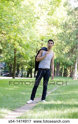 Happy young hispanic male outdoors View Large Photo Image Stock Photo - Happy young hispanic male outdoors. Fotosearch