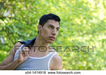 Happy young hispanic male outdoors View Large Photo Image Stock Photo - Happy young hispanic male outdoors. Fotosearch