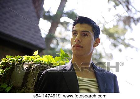 Happy young hispanic male outdoors View Large Photo Image Stock Photo - Happy young hispanic male outdoors. Fotosearch