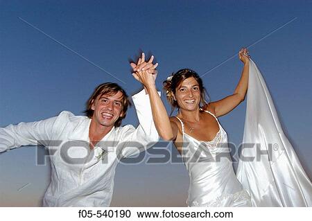 Happy young newly married couple. View Large Photo Image Stock Image - Happy young newly married couple.. Fotosearch