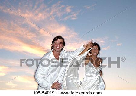 Happy young newly married couple. View Large Photo Image Stock Image - Happy young newly married couple.. Fotosearch