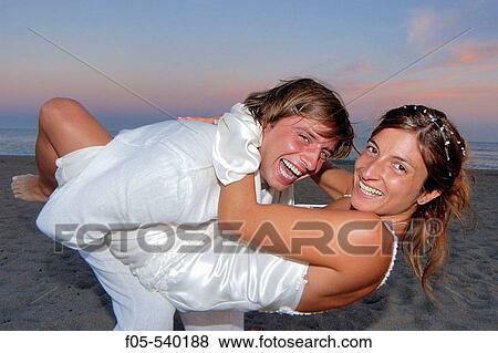 Happy young newly married couple. View Large Photo Image Stock Photo - Happy young newly married couple.. Fotosearch