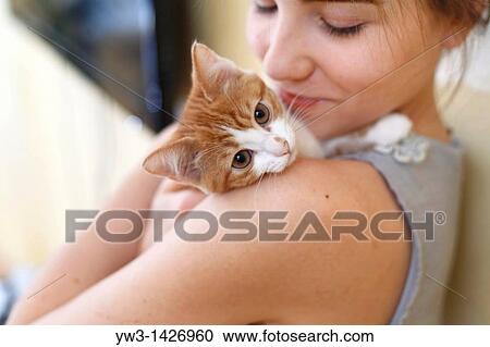 Happy young woman and red kitten View Large Photo Image Stock Image - Happy young woman and red kitten. Fotosearch