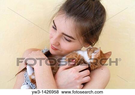 Happy young woman and red kitten View Large Photo Image Stock Photo - Happy young woman and red kitten. Fotosearch