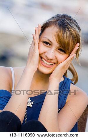 Stock Image - Happy young woman portrait. Fotosearch