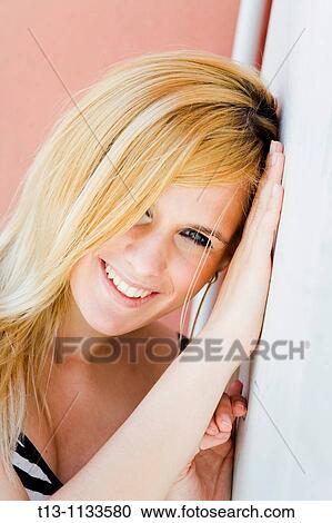 Stock Image - Happy young woman portrait. Fotosearch
