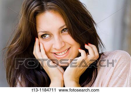 Stock Image - Happy young woman portrait. Fotosearch