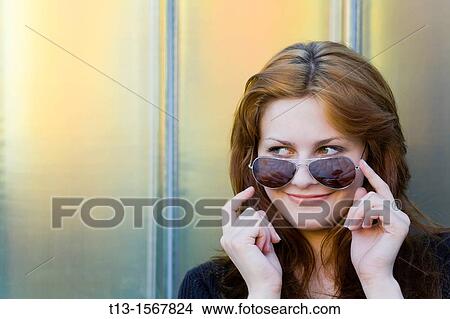 Happy young woman portrait with a sunglasses View Large Photo Image Picture - Happy young woman portrait with a sunglasses. Fotosearch