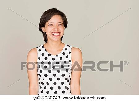 Happy young woman with dotted dress laughing. 1015 View Large Photo Image Stock Image - Happy young woman with dotted dress laughing. 1015. Fotosearch