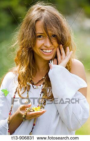 Happy young woman with small peg butterflies in hand and on robe View Large Photo Image Stock Image - Happy young woman with small peg butterflies in hand and on robe. Fotosearch