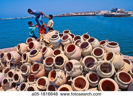 Harbour in Houmt Souk Amphora Octopus fishing Djerba island Southern Tunisia. View Large Photo Image Stock Photo - Harbour in Houmt Souk Amphora Octopus fishing Djerba island Southern Tunisia.. Fotosearch