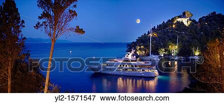 Stock Photo - Harbour of Portofino fashionable seaside fishing village for the wealthy Ligurian Coast Italy. Fotosearch