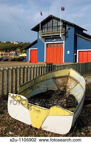 Hastings RNLI Lifeboat Station and abandoned wrecked boat, the Stade, Hastings Sussex, England View Large Photo Image Stock Image - Hastings RNLI Lifeboat Station and abandoned wrecked boat, the Stade, Hastings Sussex, England. Fotosearch