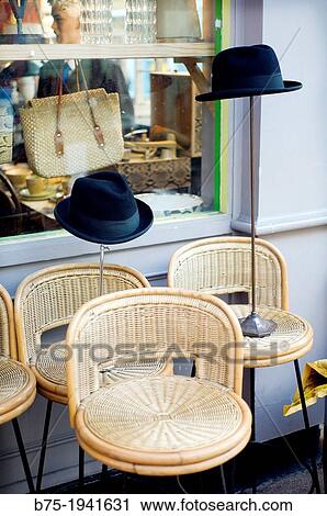 hats and chairs outside a shop in Brixton market, London, England, UK View Large Photo Image Stock Image - hats and chairs outside a shop in Brixton market, London, England, UK. Fotosearch