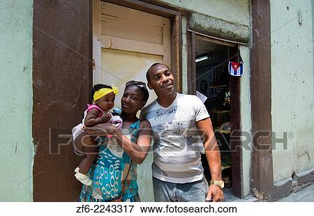Havana Cuba man and woman family with baby in front of home on street in city 1. View Large Photo Image Stock Photo - Havana Cuba man and woman family with baby in front of home on street in city 1.. Fotosearch