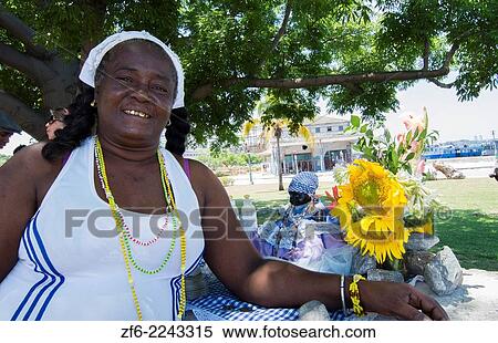 Havana Cuba Santeria woman in white with doll with African religion and catholic in Habana with gold teeth 17. View Large Photo Image Stock Photography - Havana Cuba Santeria woman in white with doll with African religion and catholic in Habana with gold teeth 17.. Fotosearch