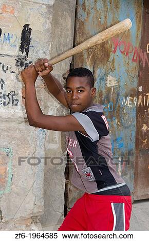 Havana Cuba young boy aged 13 hitting baseballs on street in downtown city center with bat. View Large Photo Image Stock Photography - Havana Cuba young boy aged 13 hitting baseballs on street in downtown city center with bat.. Fotosearch