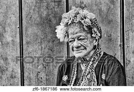 HavanaPortrait of old lady local woman with wrinkles in colorful wall in downtown Old Habana Cuba View Large Photo Image Stock Photograph - HavanaPortrait of old lady local woman with wrinkles in colorful wall in downtown Old Habana Cuba. Fotosearch